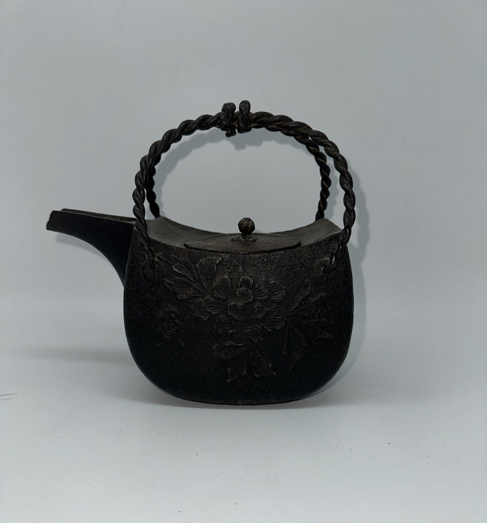 Japanese Iron Tetsubin Tea Pot. Twisted Handle. Cherry Blossom Motif.