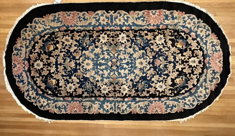 Chinese Oval Rug. Black Ground. Circa 1920s. 7' 9.5" x 4' 1.5". (LTD)