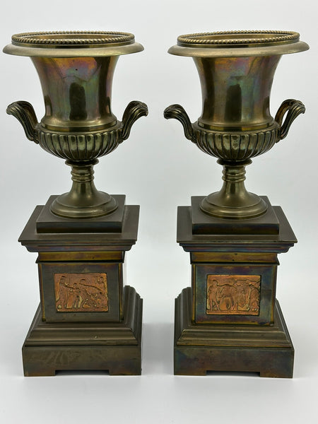 Pair Urns on Pedestal. Brass with Classical Scenes. 12" Height