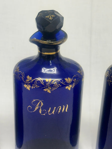 Three Liquor Decanters. Bristol Blue and Gold Glass. 18th Century